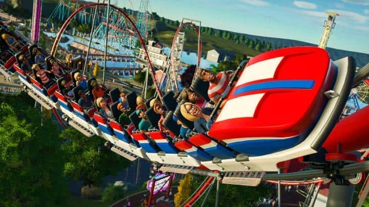 Park guests riding a roller coaster in Planet Coaster.