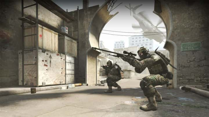 A sniper aiming in Counter - Strike : Global Offensive.