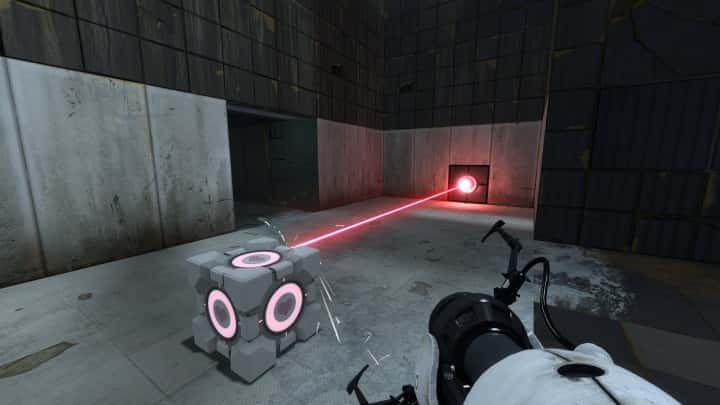 A Companion Cube blocking a laser in Portal 2.