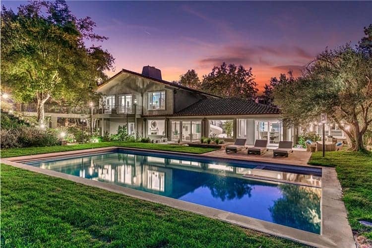 exterior of Joe Rogan's former home in Bell Canyon, California, with a rectangular pool