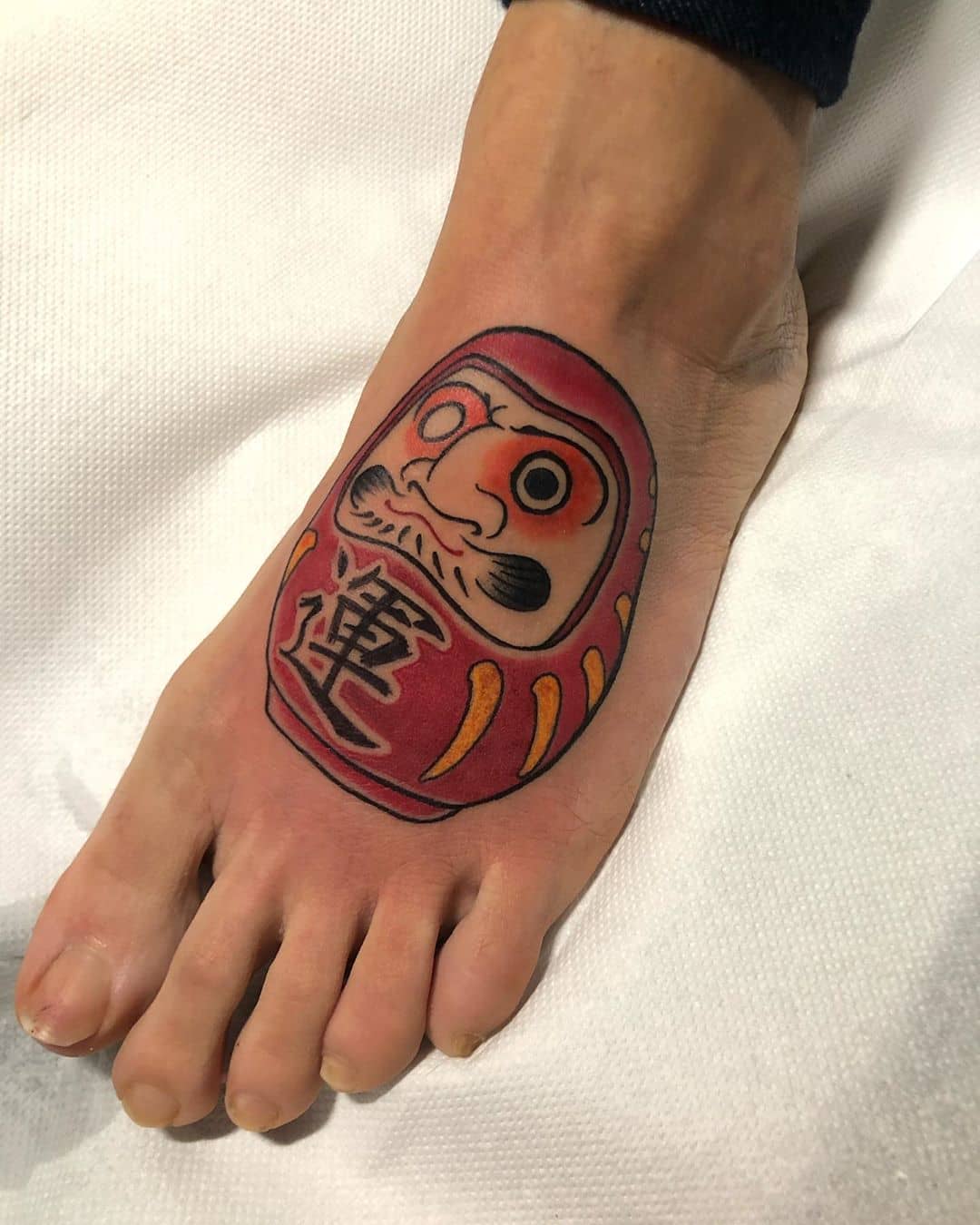 Daruma Doll foot tattoo