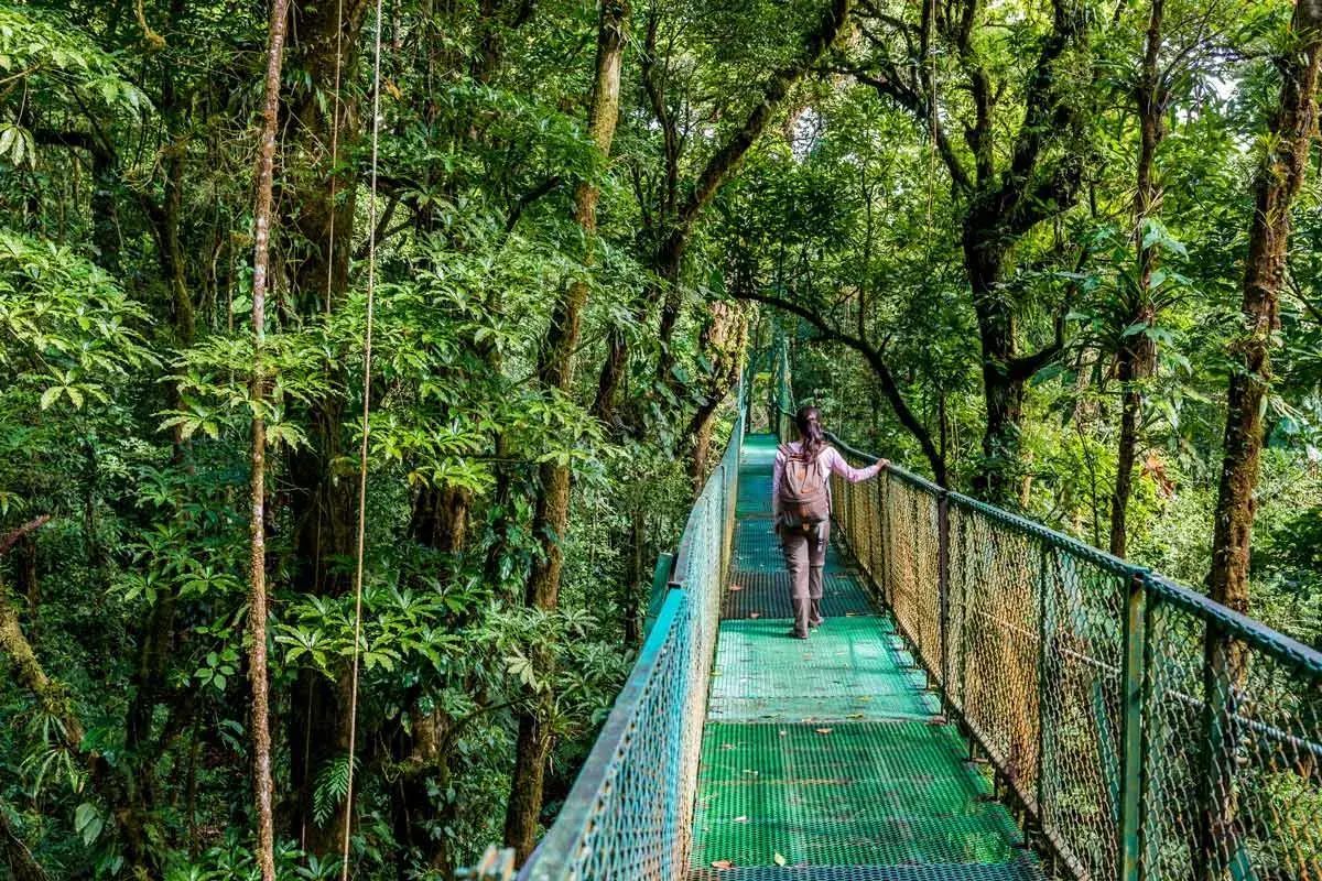 woman crossing Sky Adventures bridge in Monteverde, Costa Rica