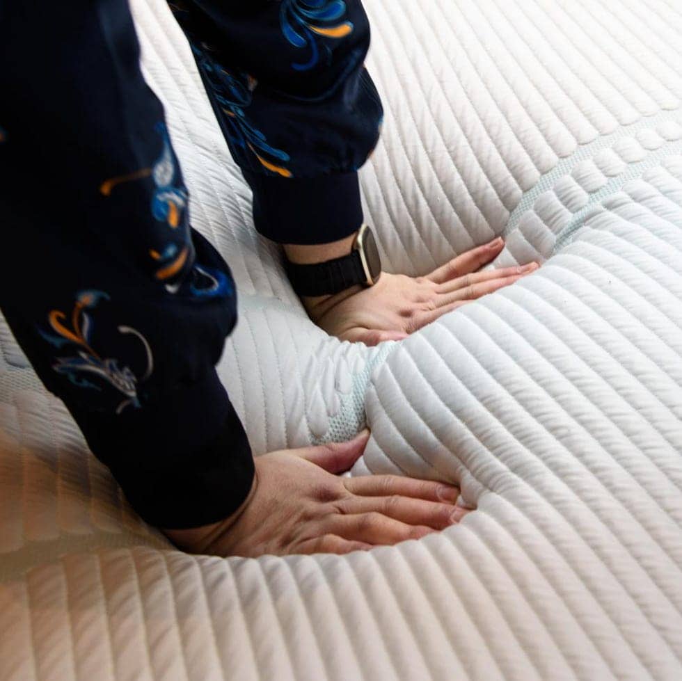 a gh analyst pressing into a tempurpedic mattress