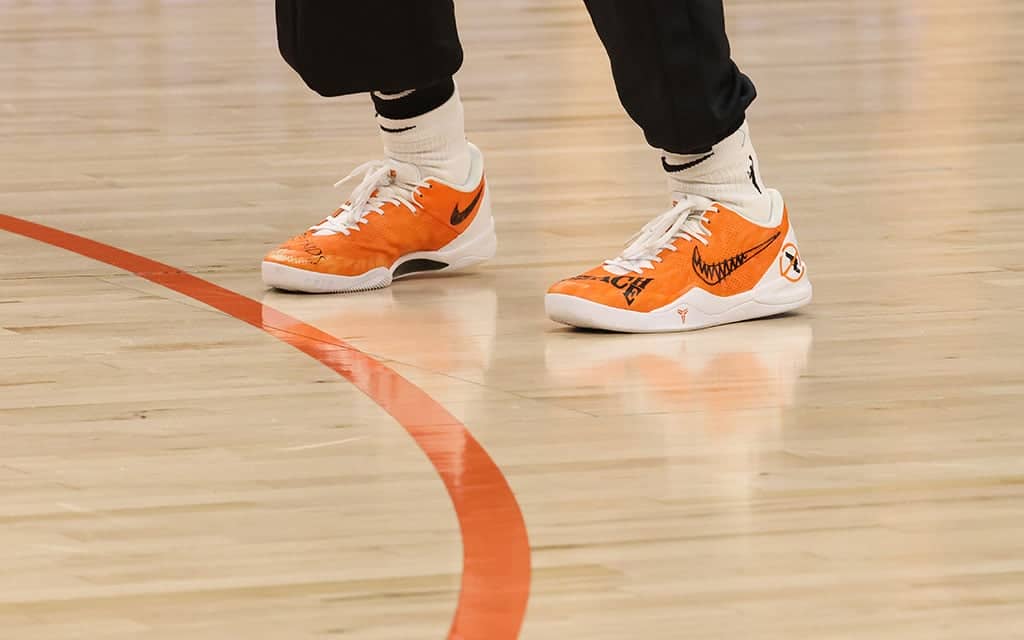 Phoenix Mercury guard Natasha Cloud's shoes say "Protect Kids Not Guns" and "Teach Peace" to honor Gun Violence Awareness Day at Footprint Center on June 7. (Photo by Shirell Washington/Cronkite News)