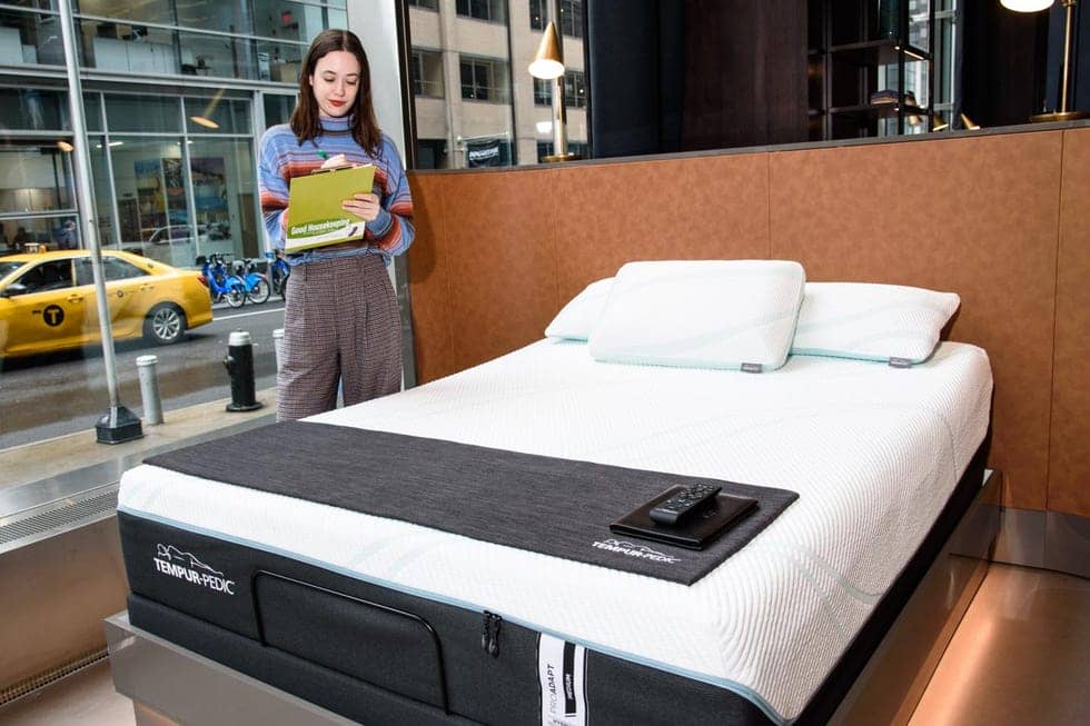 a gh analyst inspecting a tempur pedic mattress