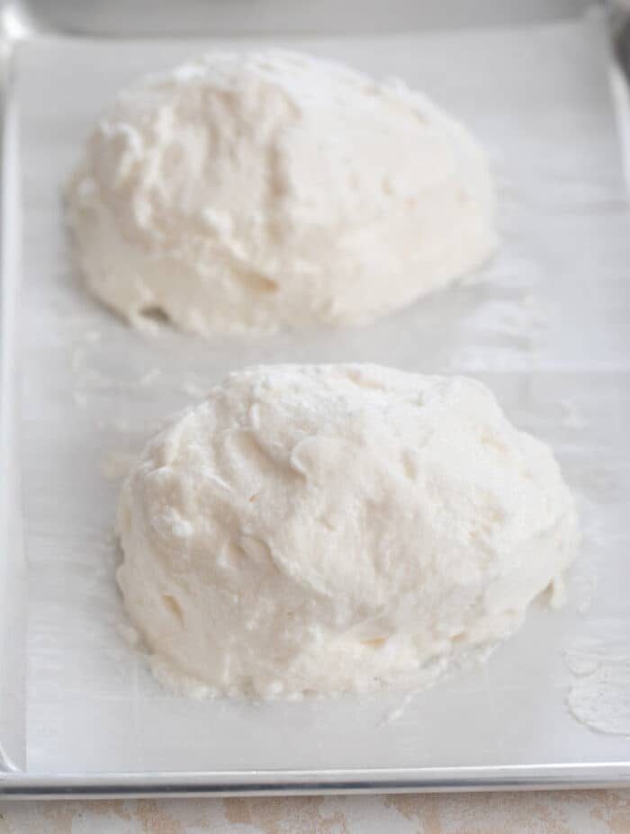 cloud bread batter on a baking sheet lined with parchment.