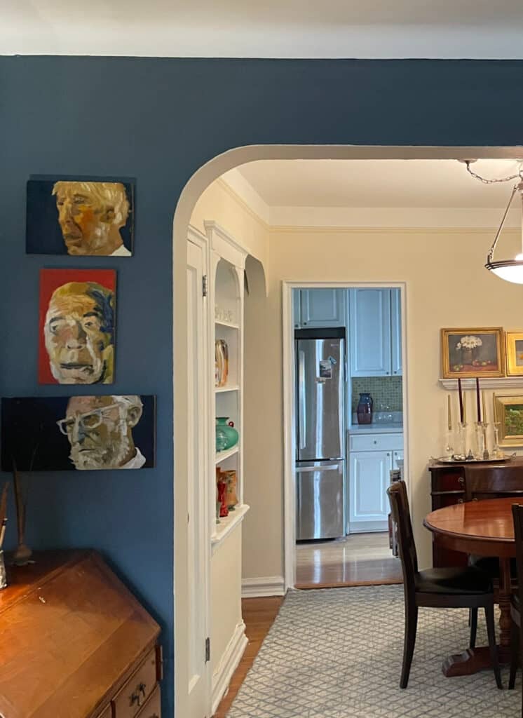 Benjamin Moore Blue Spruce, best shade of blue paint color, arched openings, cove ceilings, Antique White cream paint color in dining room, vintage style home. Kylie M Interiors