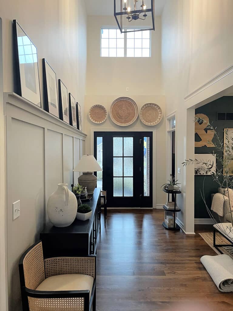 Entryway, board and batten, dark brown oak floor, black front door, side lights, hoem decor, Revere Pewter and Benjamin MooreChamois, White Dove