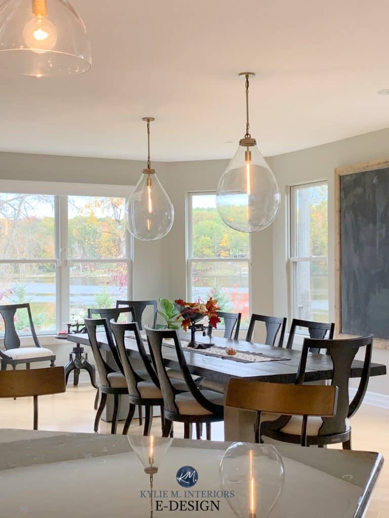 Benjamin MooreRevere Pewter in dining room with dark wood furniture and pendant lights. Best warm gray. Kylie M Interiors Edesign, client photo. Decorating blog