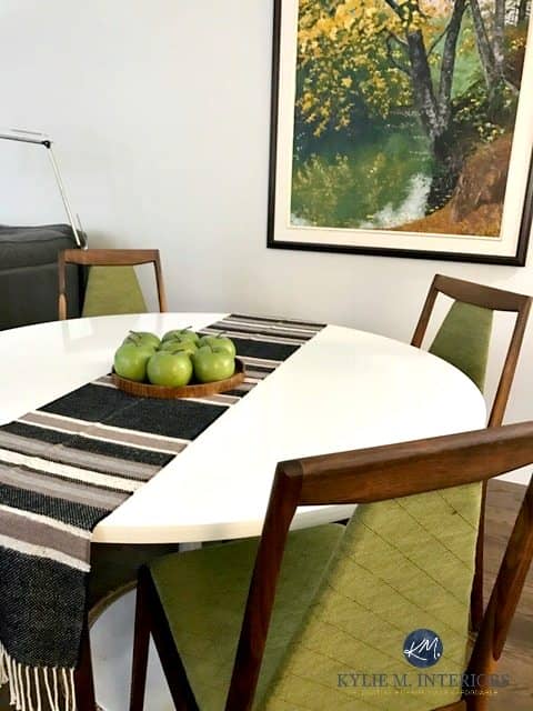 Benjamin MooreSilver Satin with green accents in a mid century modern dining room with furniture and decor. Kylie M INteriors E-design