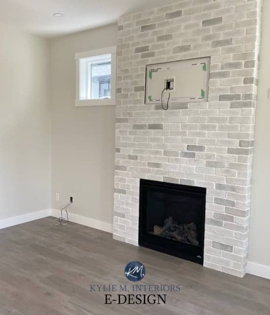 Benjamin MooreClassic Gray, off white warm gray. Brick fireplace white wash look. Gray wash laminat wood floor. Kylie M Interiors Edesign, diy blogger