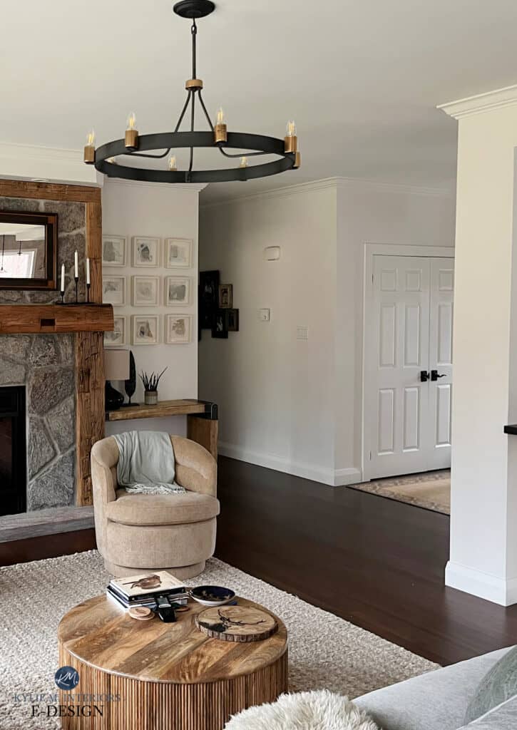 Stone fireplace with rustic reclaimed wood mantel, dark wood floor, Benjamin MOore White Dove, warm creamy white on walls, trims, ceiling, color drench.